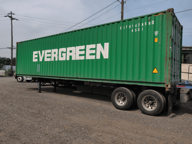A green container with the word Evergreen on it.